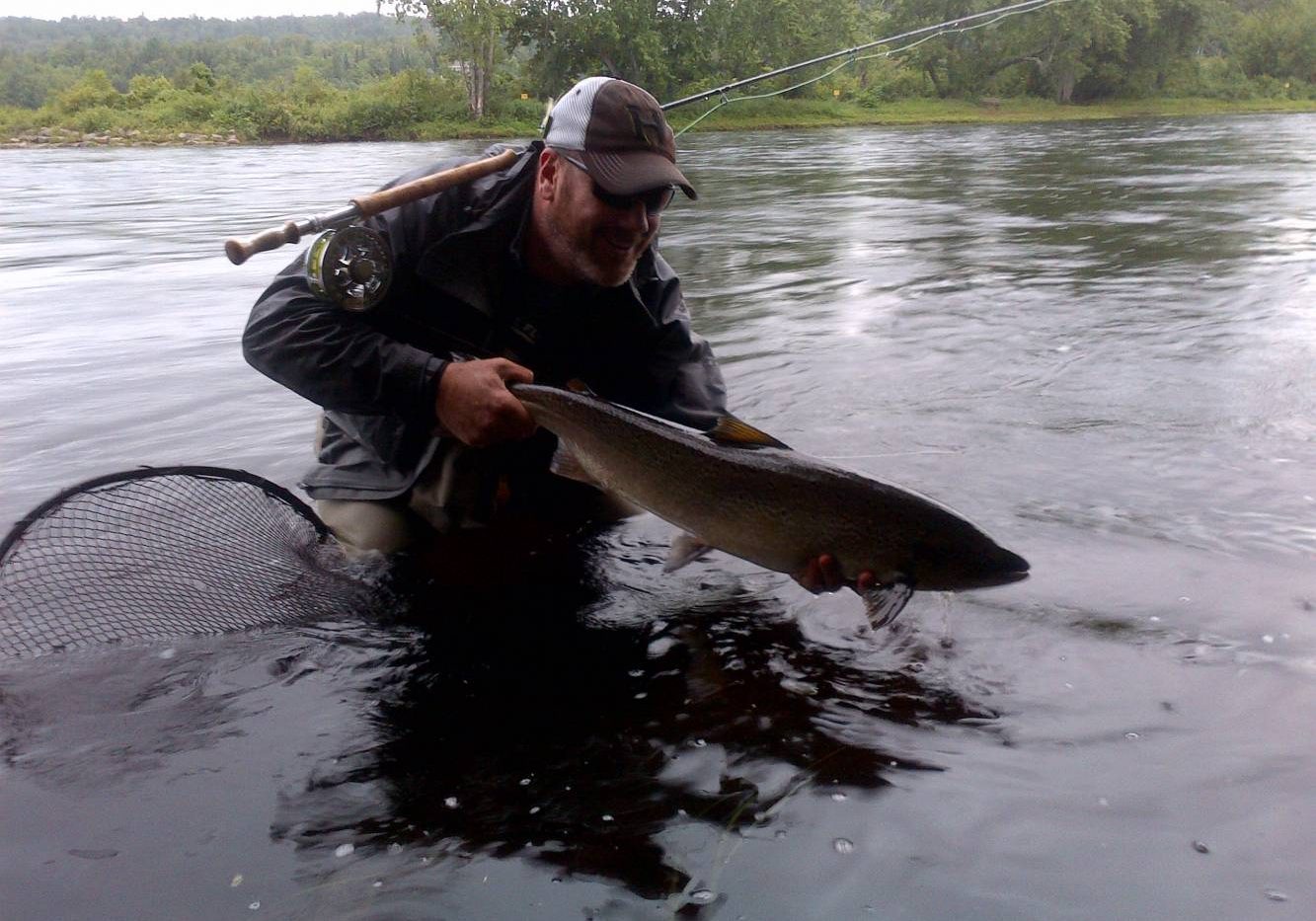 David Bishop from Cascapedia Quebec with one of 3 salmon he hooked