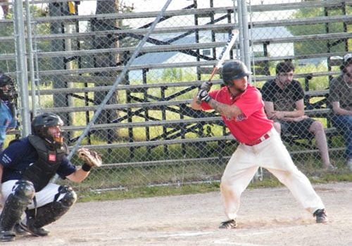 Brewers catcher Blake Lynch keeps a close eye on Red Sox batter Brett Goodin.