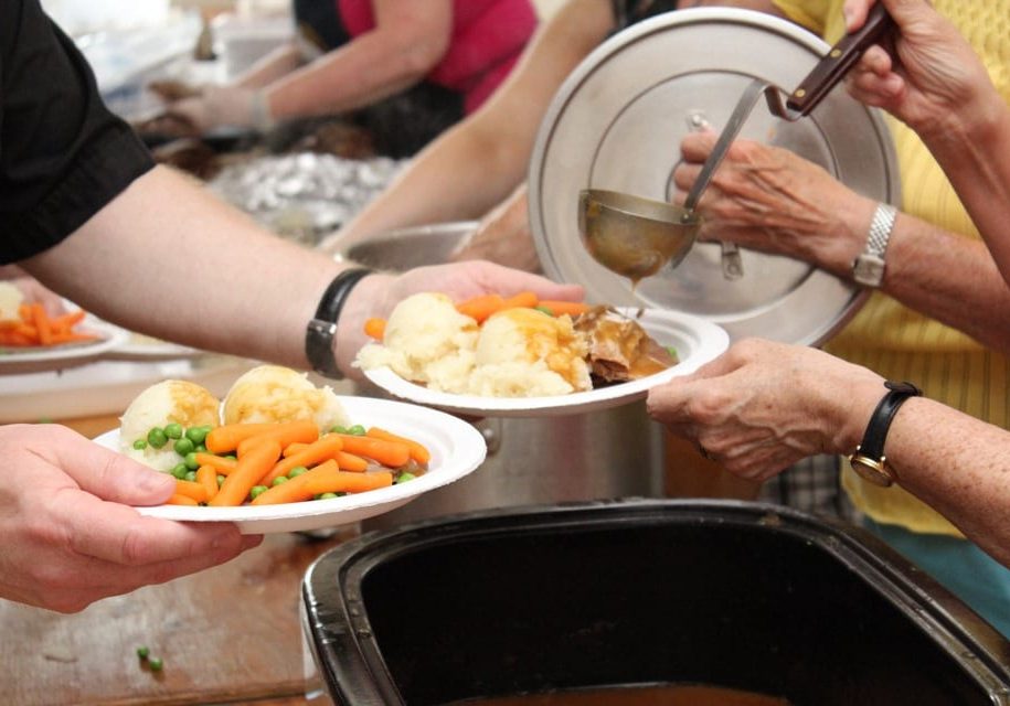 Volunteers serving meals for those affected by Tropical Storm Arthur