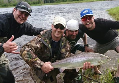 Jeff Morris with a nice bright salmon caught on the Northwest Miramichi