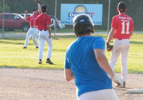 Miramichi Men's Fastpitch action: Stephen Boulay makes a grab in the outfield, dashing the hopes of the Douglasfield Dodgers.