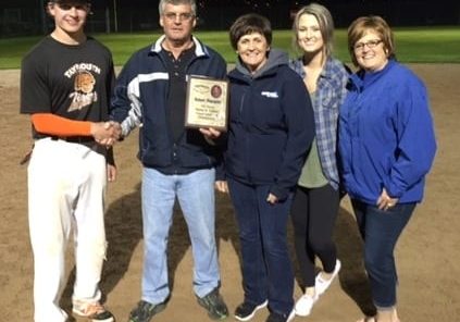 David Brewer, of the Taymouth Tigers, accepts the championship plaque from members of the Blacquier family - Raymond Blacquier, Roxanne Regan, Jenna MacKnight & Sherri Lynn MacKnight