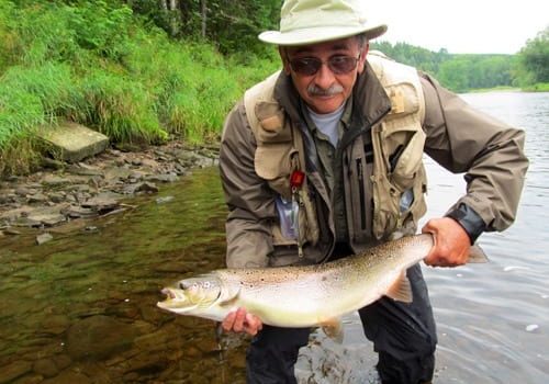 Peter Clark with a 22 pound salmon caught on a chartreuse bomber, number 4.