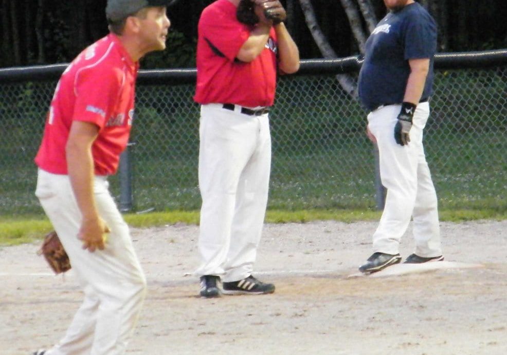 Sox Pitcher Jason Lynch, and first baseman Jimmy Keenan, look to the play, while Brewers base runner Blake Lynch weighs his options.