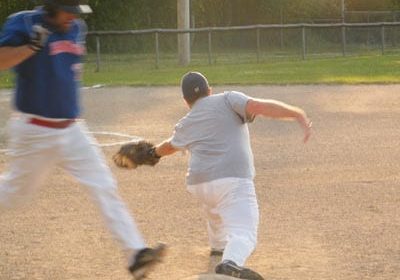 Matthew Hebert of the Miramichi 'Towne Ford' Rangers is out by a step, thanks to the quick glove of Brewers' first baseman Blake Lynch.