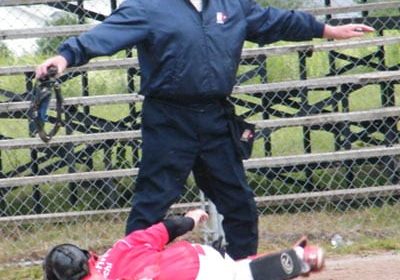 Umpire Pete McLean makes the call at home plate, as the Rangers score another on the way to a 12-8 victory.