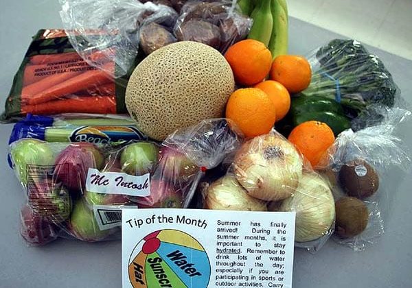 Contents of a typical Community Fresh Box which also contain tips and recipes.