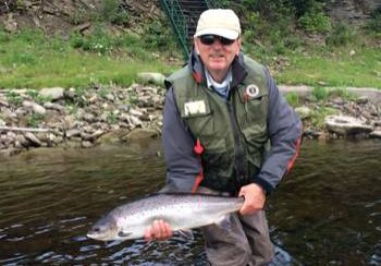 John McGuire with a nice fresh July salmon. Landed at one of Ledges pools on July 24th.