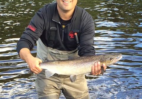 Joe Palmer with a hookbill salmon he caught on a blue bomber