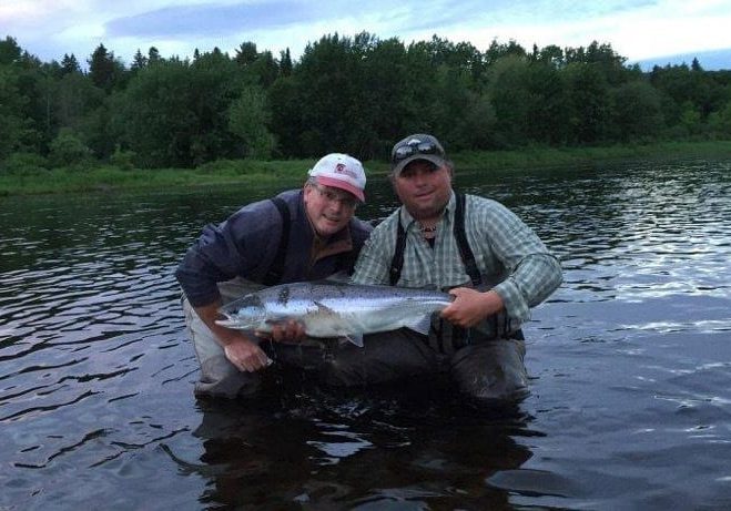 Stephen Leger with a nice June salmon, accompanied by guide Derek Munn.