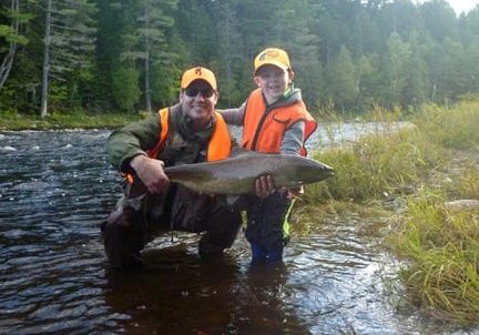 From our archives: Jeff Morris and son Ben with a very nice salmon caught on the Main Sounthwest Miramichi.