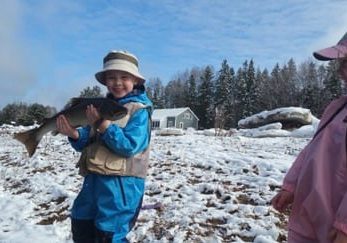 Young anglers with Jeff Morris catch and release a nice spring fish.