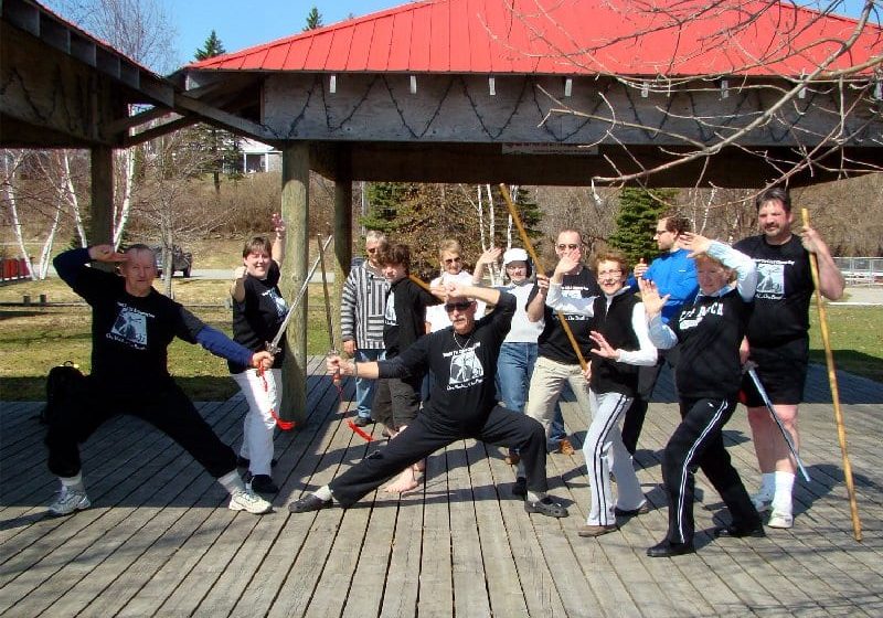 Dave's Tai Chi group in Miramichi strike a pose for the camera.